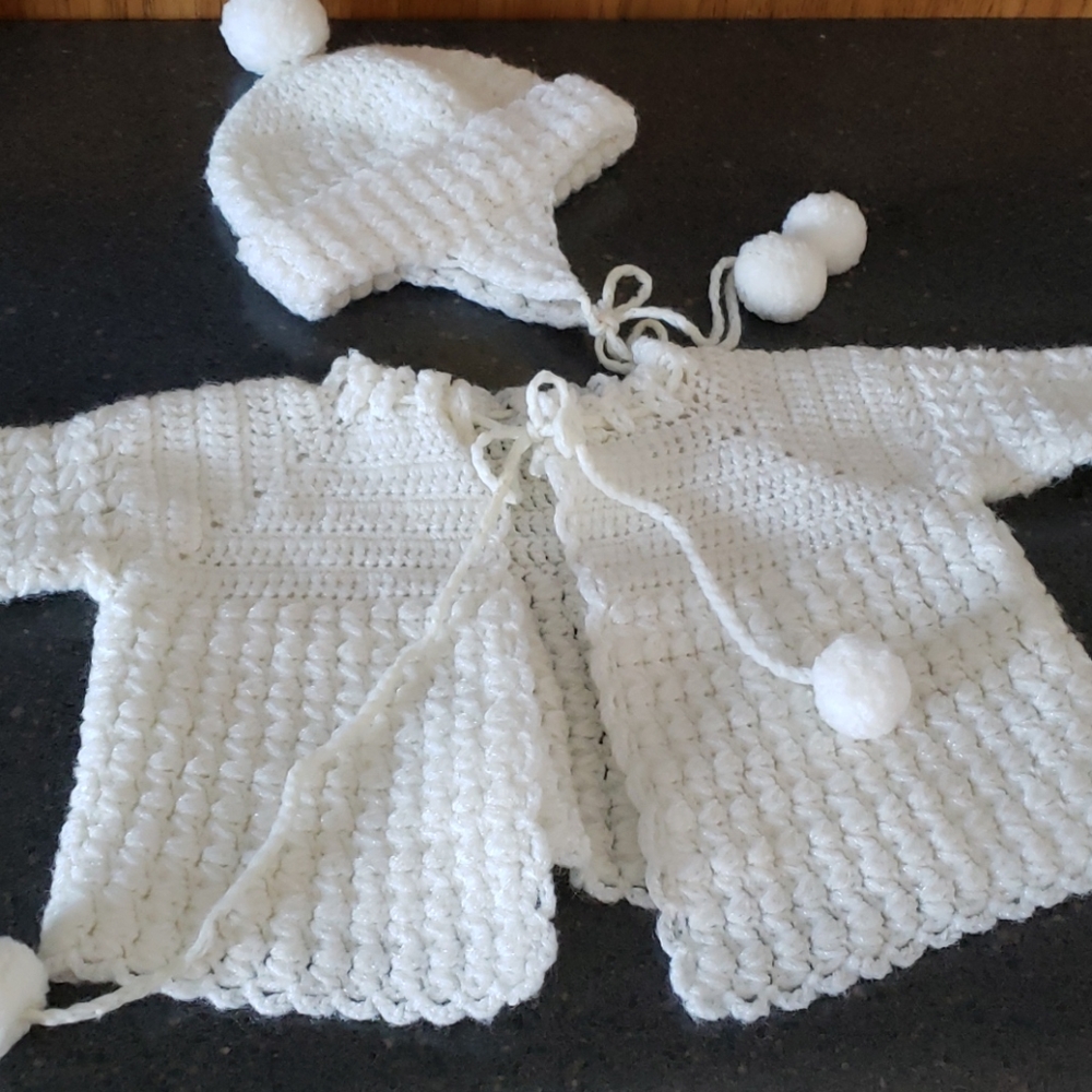 Homemade crochet baby hat and sweater